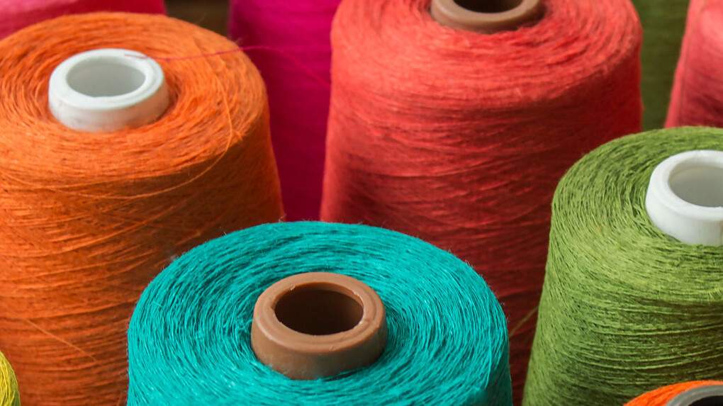 Bobbins with different coloured threads
