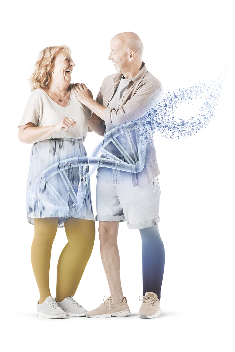 Two people are laughing together. In the foreground is a diagram of DNA Two people are laughing together. In the foreground is a diagram of DNA